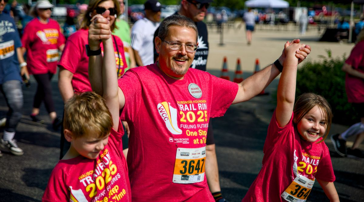 one adult two children, from the community participating in Waubonsee Foundation Annual Trail Race Fundraiser