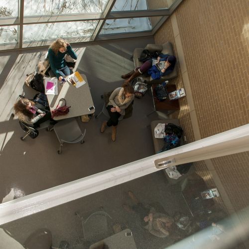 Students sitting at table aerial view S