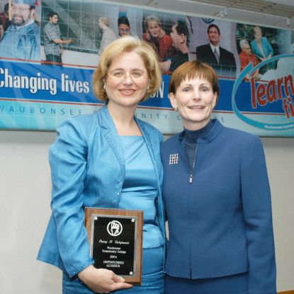 2004 Distinguished Alumnus Penny Panayiota Deligiannis with Dr. Sobek