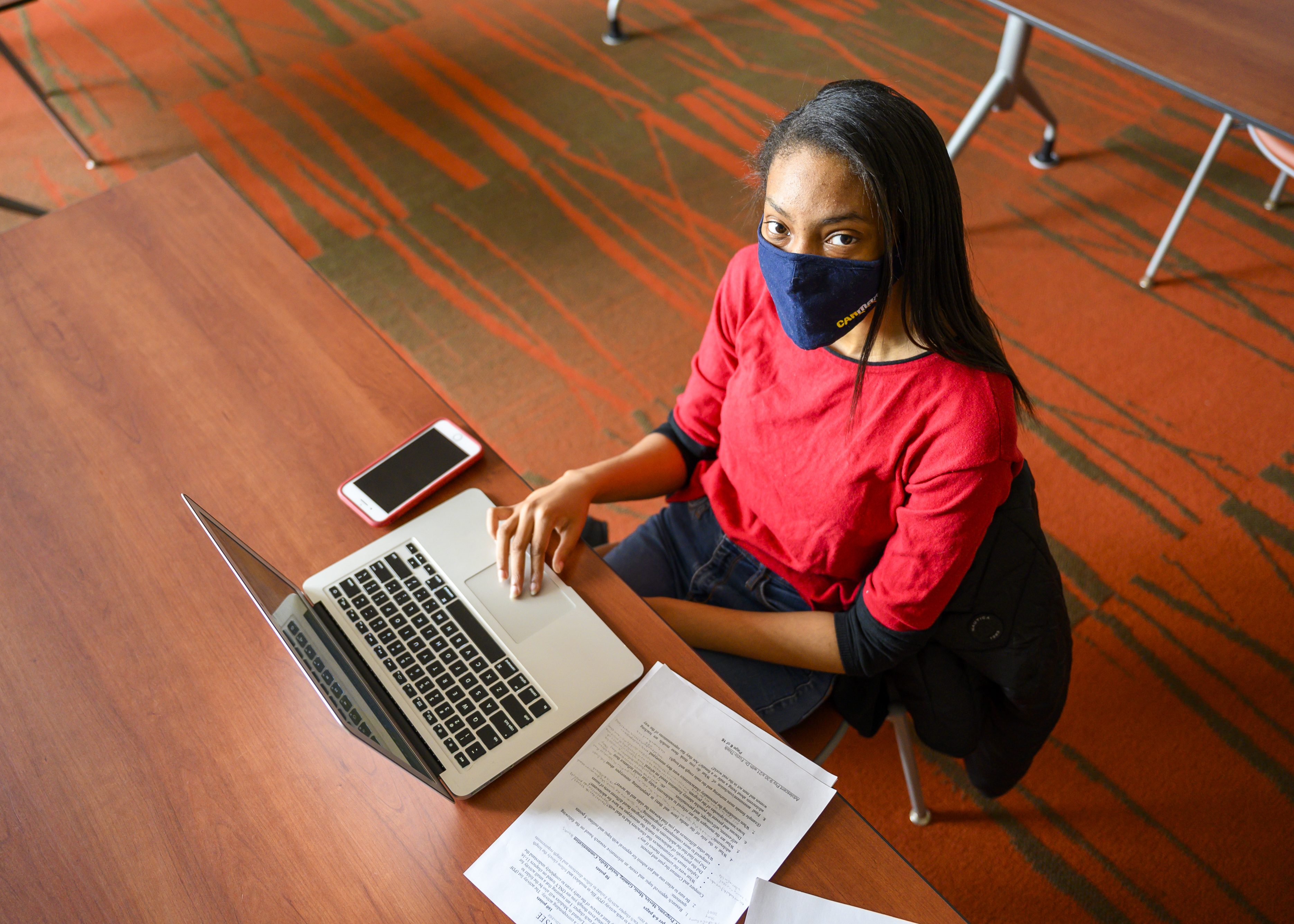 Female student with mask on laptop | Waubonsee Community College