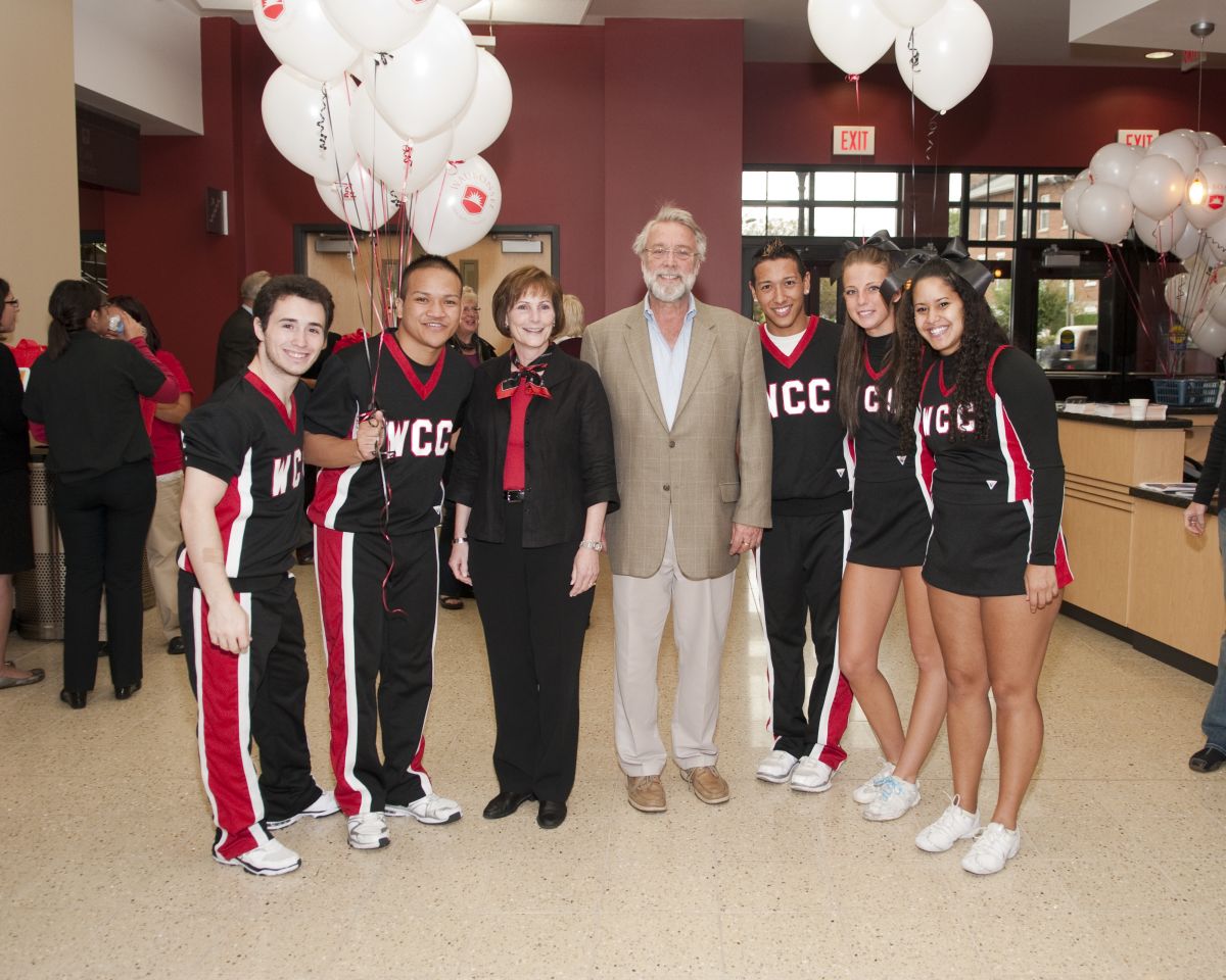 Dr. Sobek, former City of Aurora Mayor Tom Weisner, and Waubonsee cheerleaders at the 2011 Open House for the new Aurora Downtown Campus.