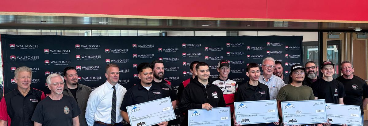 NHRA Professional Racer and team owner Steve Johnson visited with Waubonsee Community College automotive students and presented five students with the "Be a Technician" (Bat-man) national scholarship.