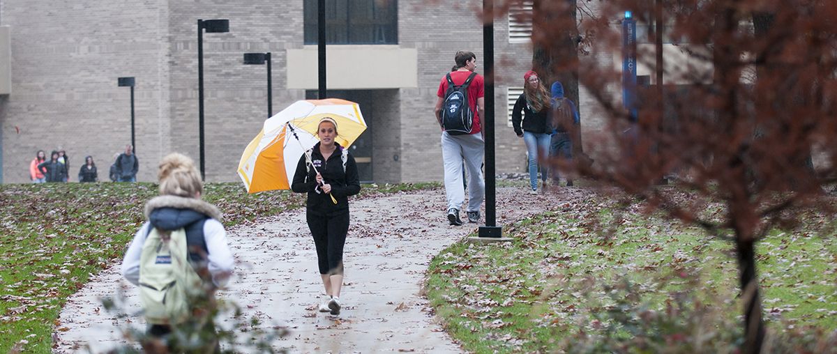 Students in the Rain at Student Center in Sugar Grove