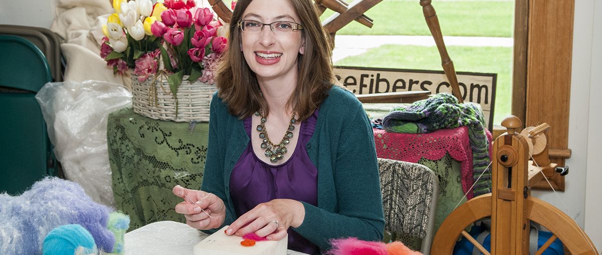 Woman creating fiber art inside L