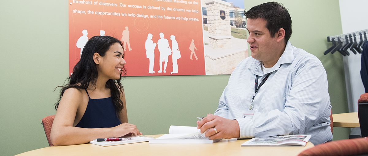 student getting advice by a counselor