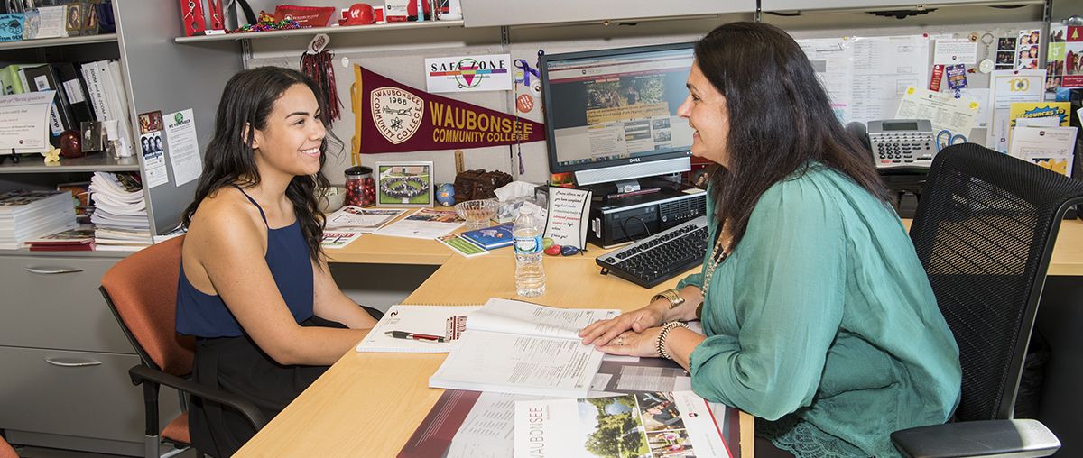 student getting advice by a counselor