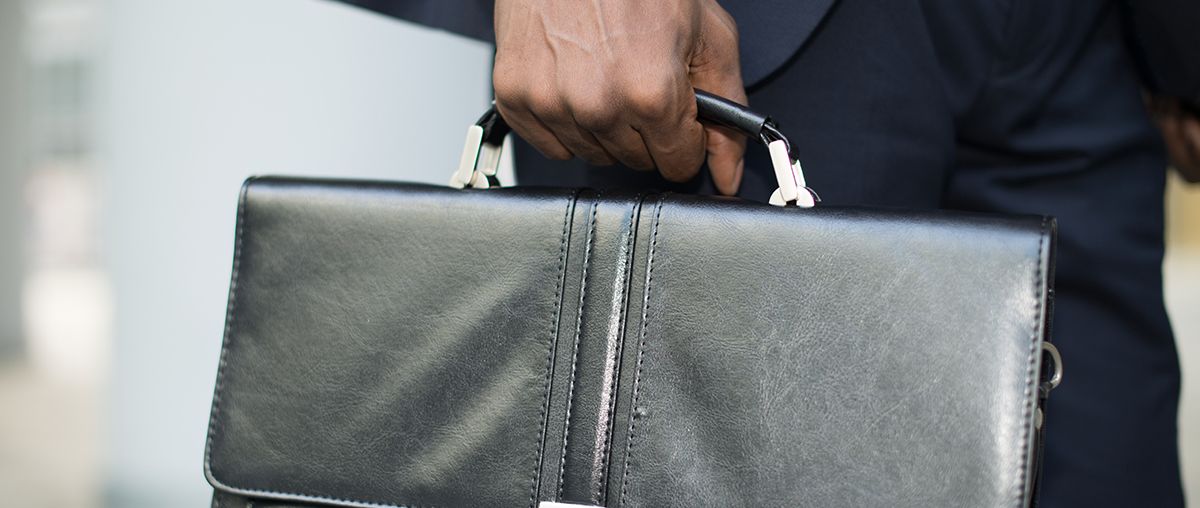 businessman holding his briefcase