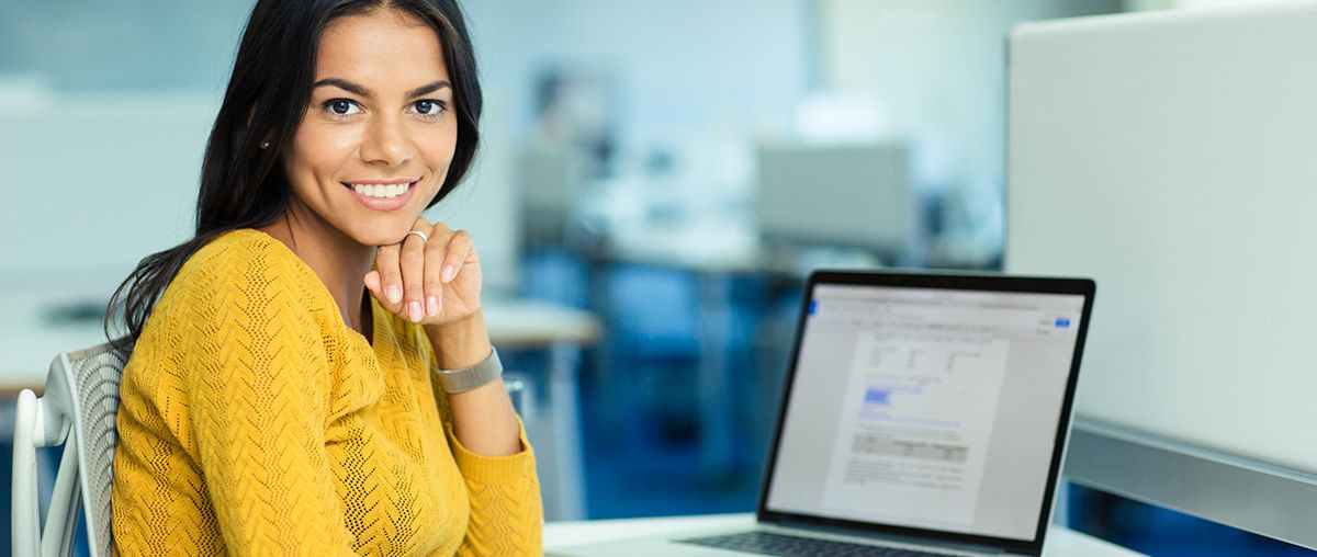 woman with laptop inside L