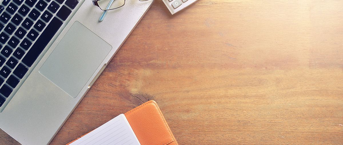 Laptop on desk with glasses L