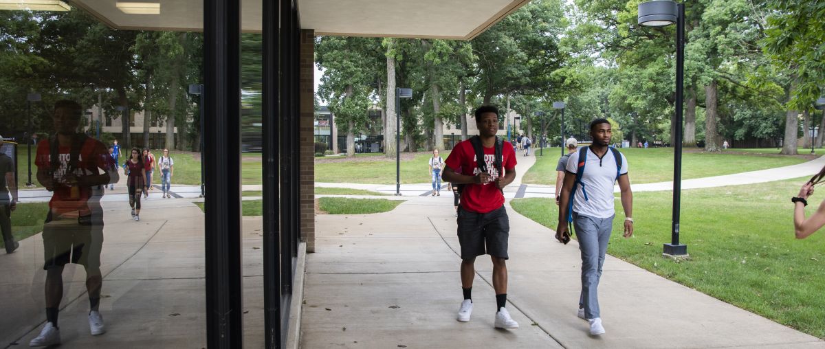 students walking near collins hall