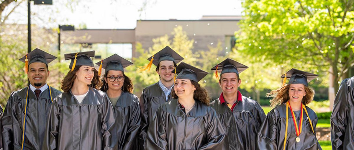 Photo of QuickPath students in graduation caps and gowns