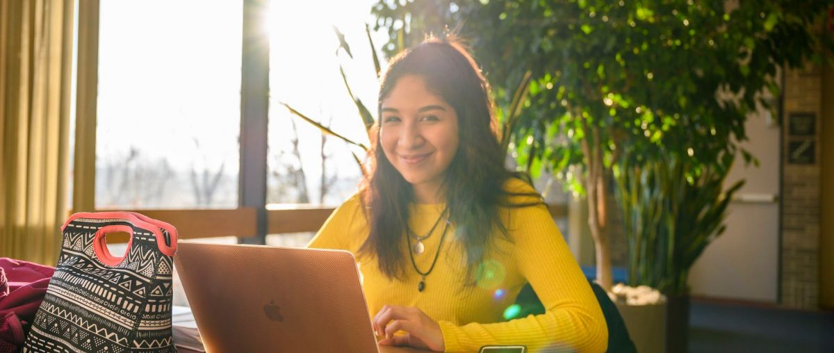 Female student working on a laptop