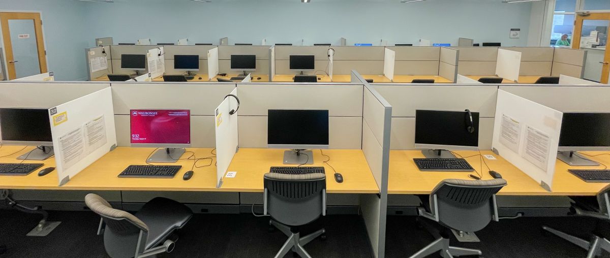 Testing Center room filled with computer stations and chairs