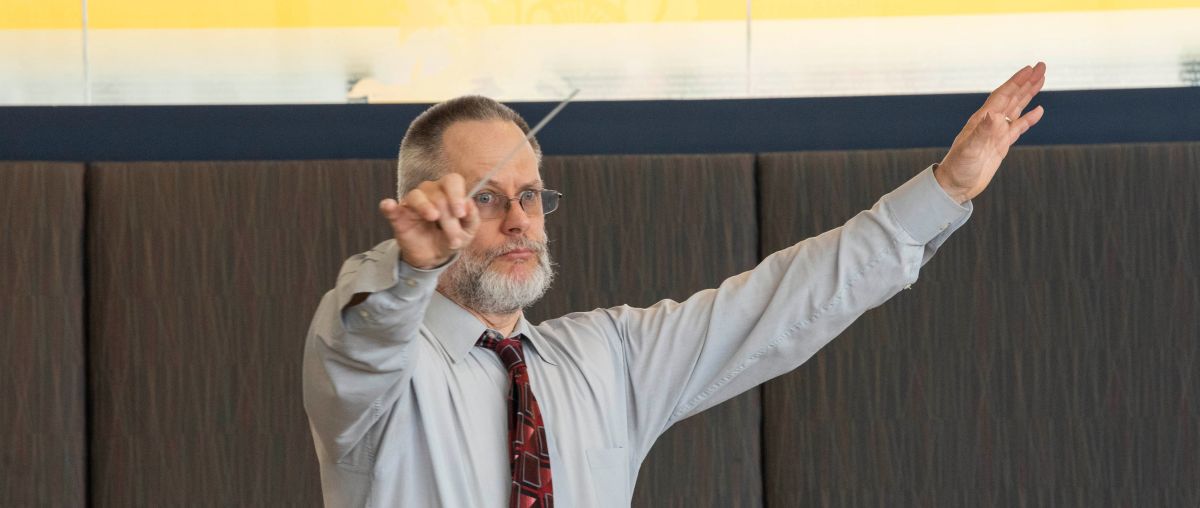 Dr. Mark Lathan conducting music class