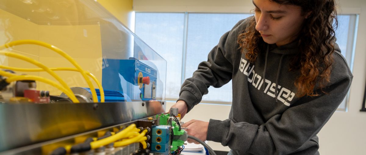 Industrial Maintenance Student working on simulator