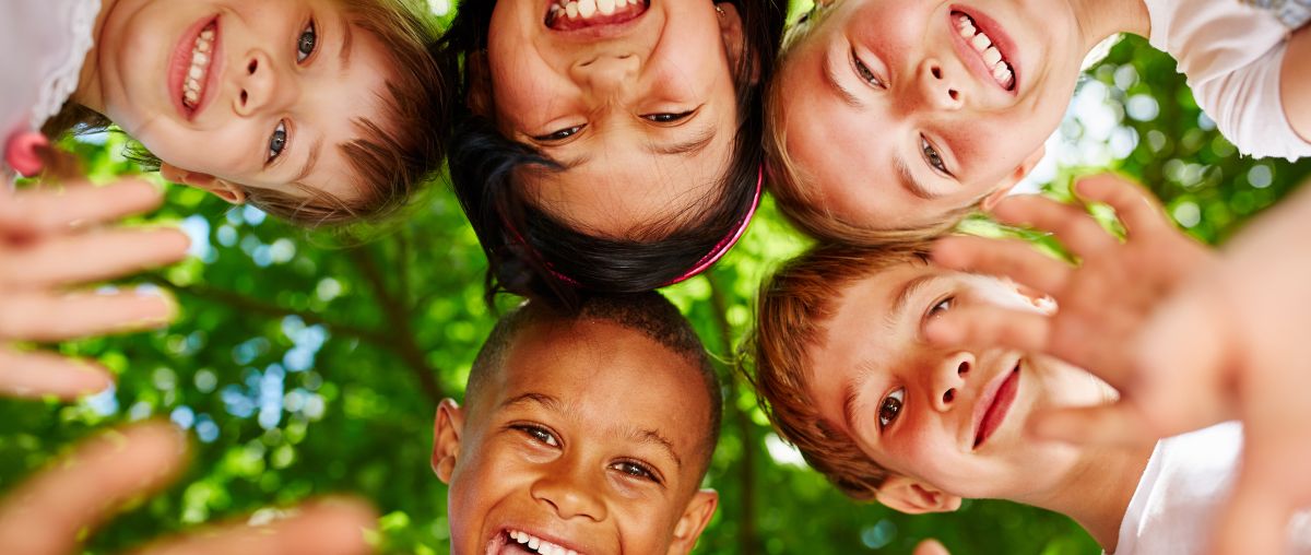 Group of kids in circle waving