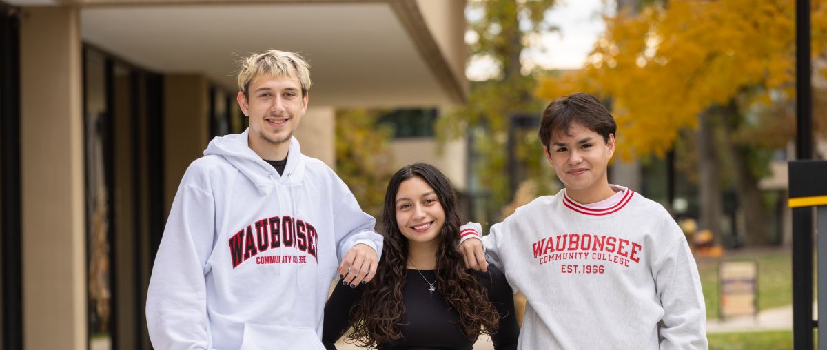Three students on campus with waubonsee swag