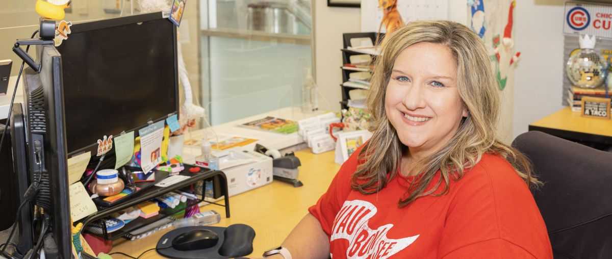 Dawn Harvey working at her office desk