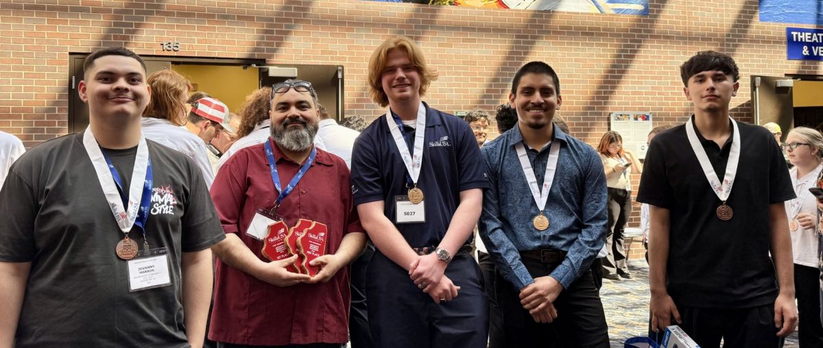 Waubonsee students Jovanny Marron, Ben Swanson, Alex Soto, and Javier Solis join Instructor Ramiro Cervantes (second from left) at the SkillsUSA Illinois State Championships.