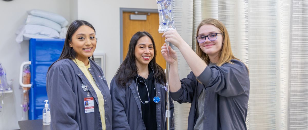 Nursing Degree Pathways nurses three nurses portrait in classroom
