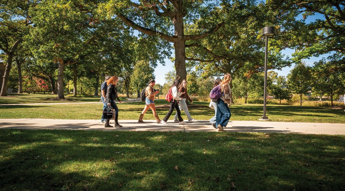 Students walking across campus in fall 2024