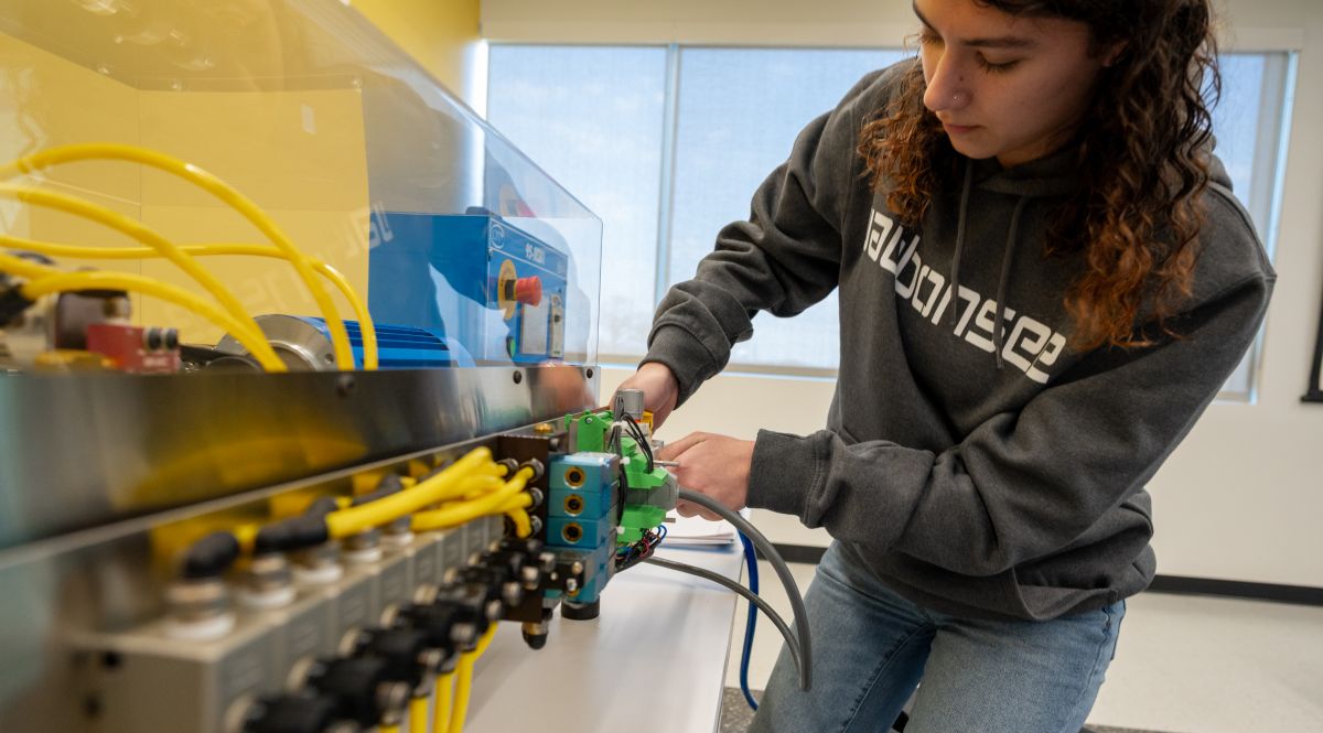Industrial Maintenance Student working on simulator