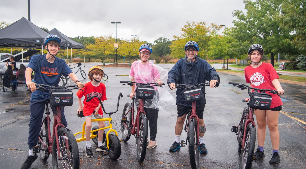 family of 5 sitting on their bikes