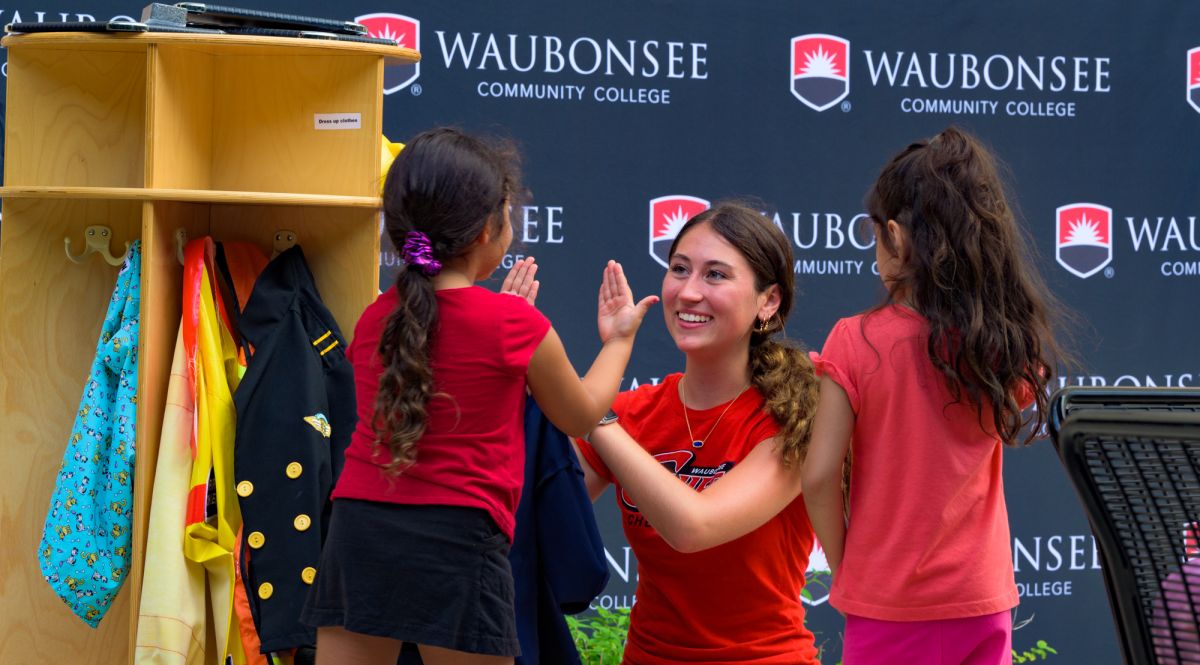 Mom with two kids at Back to School Bash event