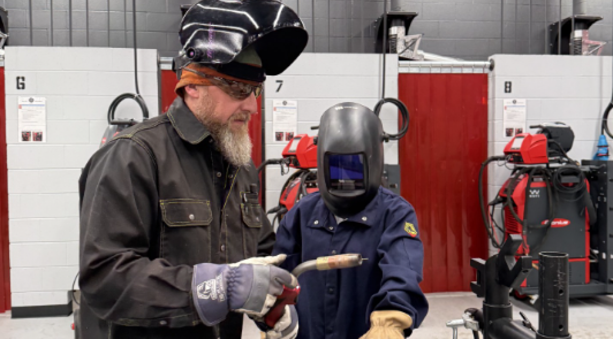 Welding Class teacher and student