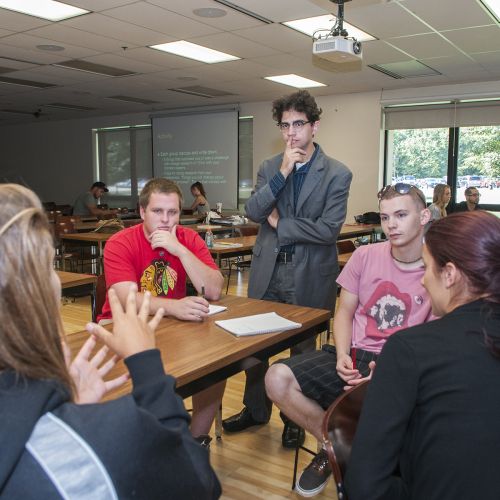 English class faculty working with students
