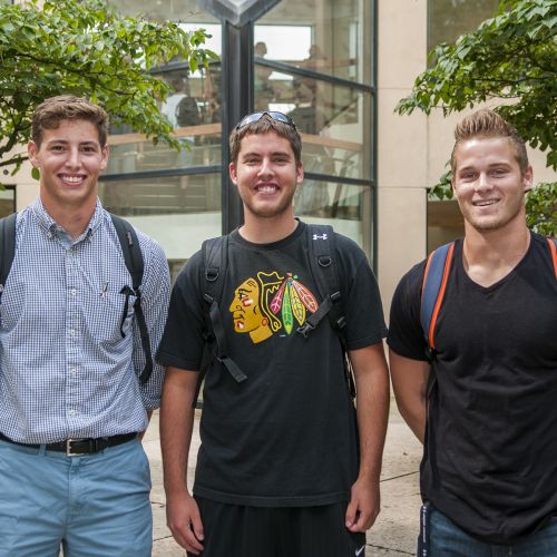 Students standing outside males summer S
