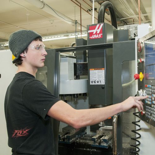 Student in CNC lab
