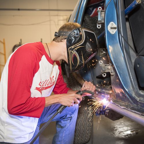 Student welding in Auto Body