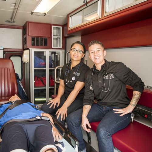 Paramedic students working in the ambulance sim