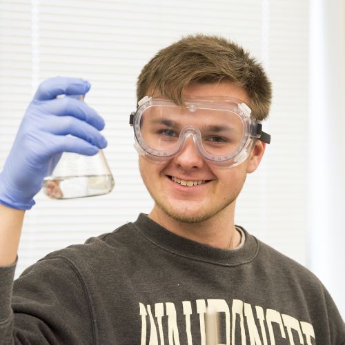 Chemistry class student with beaker S