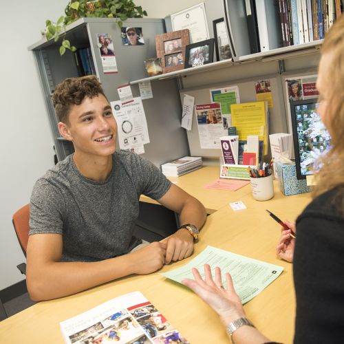 student getting advice by a counselor