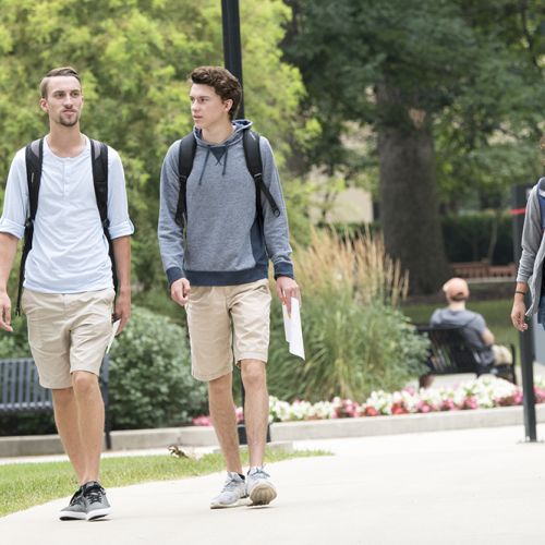 Students walking outside summer L