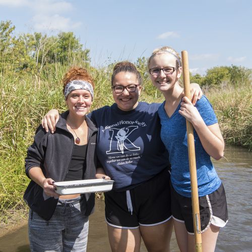 Students Biology standing in pond in summer S