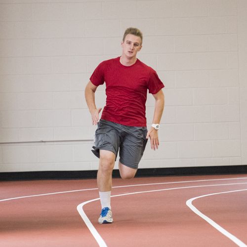 Student running on track