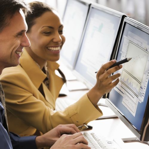 Man and woman looking at computer screen s