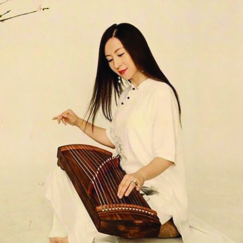 Woman plays traditional Chinese musical instrument