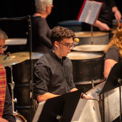 Students playing the steel drums during a concert