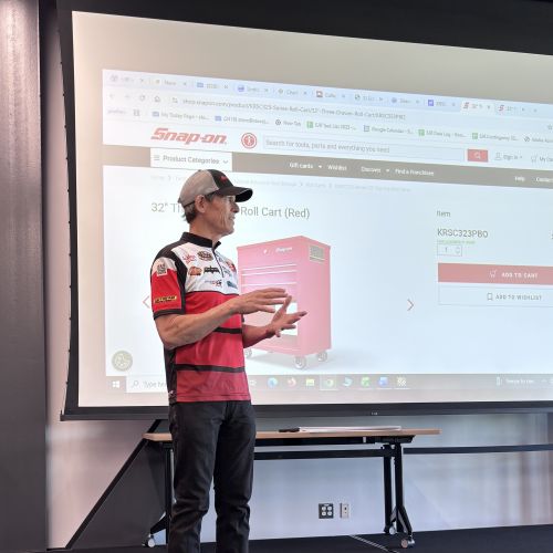 NHRA Professional Racer and team owner Steve Johnson visited with Waubonsee Community College automotive students and presented five students with the "Be a Technician" (Bat-man) national scholarship.
