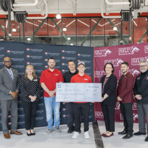 Pictured (left to right): Clayton Muhammad, Vice President of Community Engagement and External Affairs; Sarah Kocunik, Graduation and Transfer Coordinator; Tyler Friedland, Assistant Professor of Automotive Technology; Guy Tiberio, Associate Professor of Automotive Technology; Justin Winters; Agnes Szemborski, Assistant Vice Chancellor for External Relations; Sergio Vlahovic, Student Success Coach; and Rey Diaz, Transfer Admissions Representative 