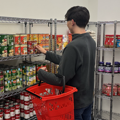 Student browsing for food in pantry