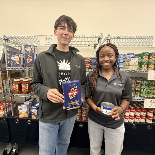 Waubonsee student workers John Metych (Left) and Germaine Mwizera (Right) stock the shelves ahead of the fall semester.