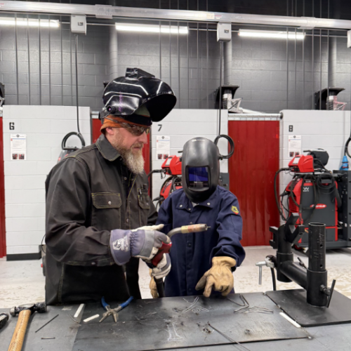 Welding Class teacher and student