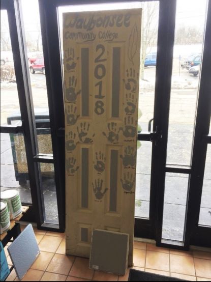 Photo of a door decorated by students on Alternative Spring Break 2018