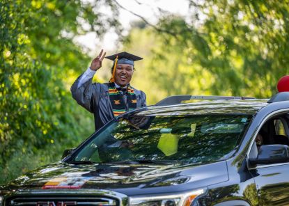 student in car at 2021 graduation parade