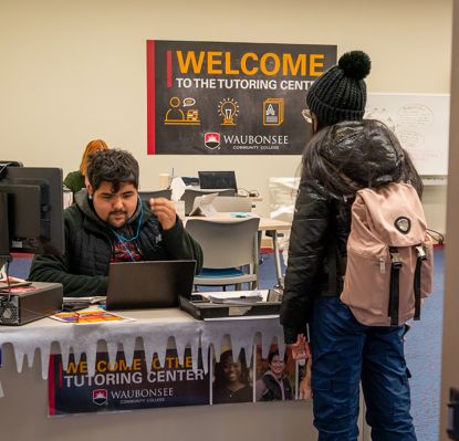 Tutoring Center Desk - staff member helping student